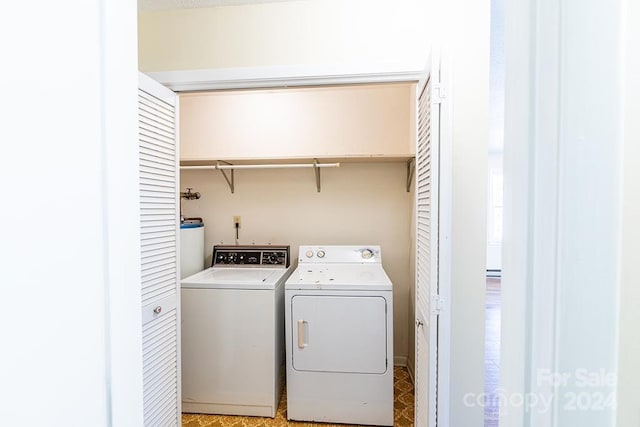 washroom with washing machine and dryer