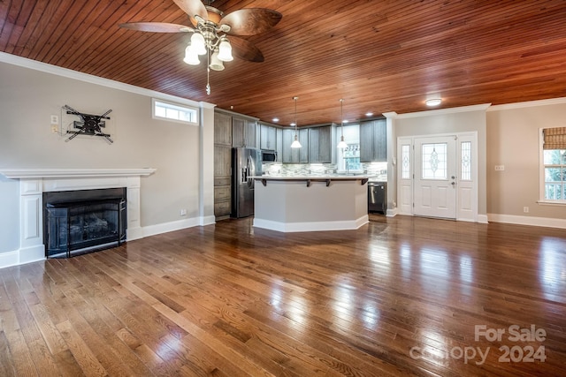 unfurnished living room with hardwood / wood-style flooring, ceiling fan, wooden ceiling, and ornamental molding