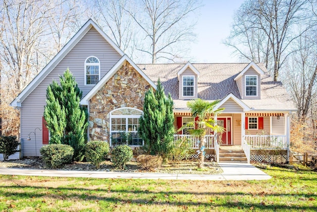 view of front of property with a front yard and a porch