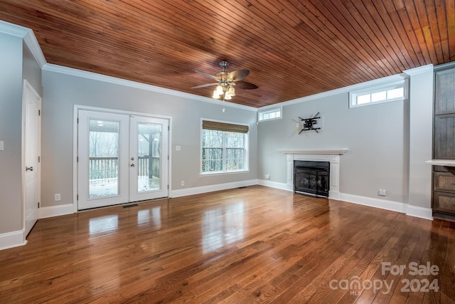 unfurnished living room with french doors, ceiling fan, crown molding, wood-type flooring, and wooden ceiling