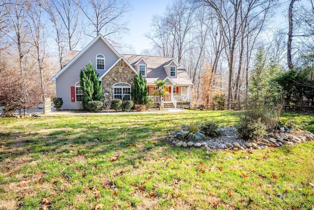 view of front of home featuring covered porch and a front lawn