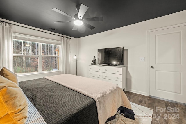 bedroom featuring dark hardwood / wood-style floors and ceiling fan