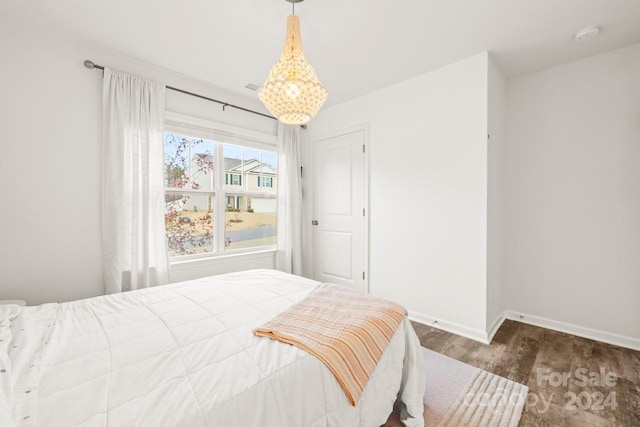 bedroom featuring dark hardwood / wood-style flooring