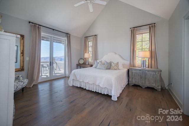 bedroom with access to exterior, ceiling fan, dark wood-type flooring, high vaulted ceiling, and a mountain view