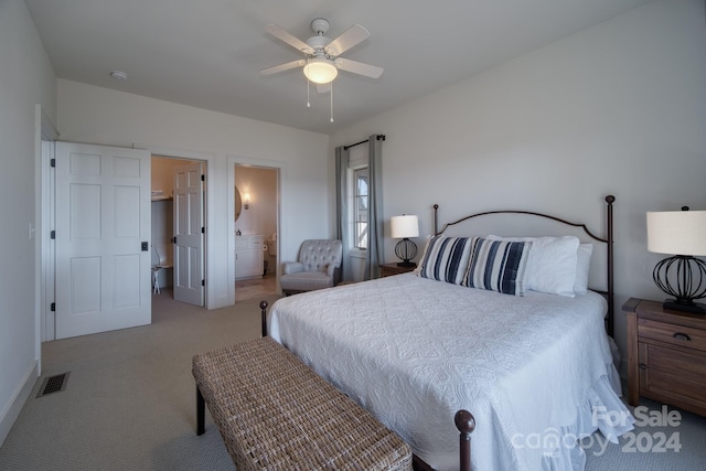 carpeted bedroom featuring ensuite bathroom and ceiling fan