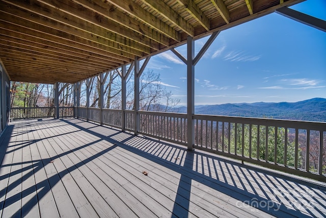 wooden deck featuring a mountain view