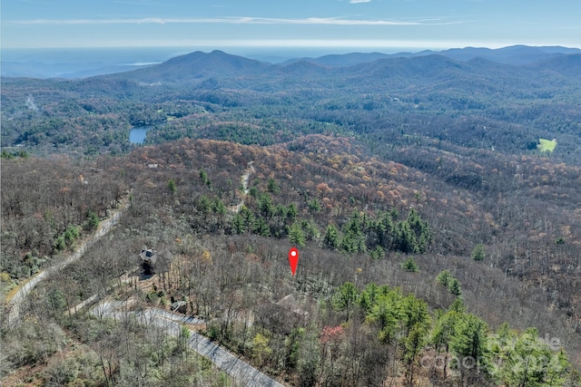 aerial view featuring a water and mountain view