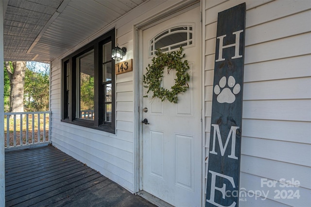 entrance to property with covered porch