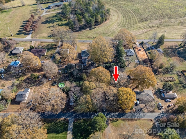 birds eye view of property with a rural view