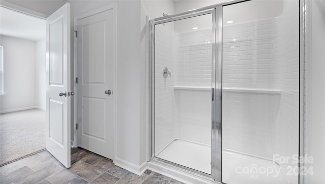 bathroom featuring an enclosed shower