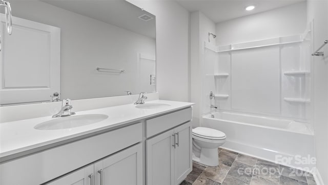 full bathroom featuring vanity,  shower combination, and toilet