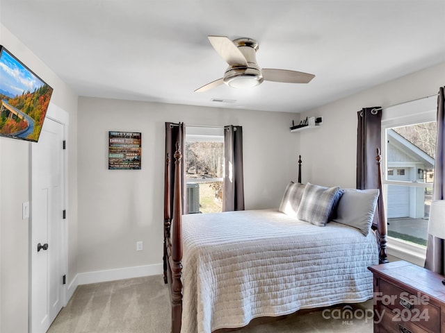 bedroom featuring ceiling fan and light colored carpet