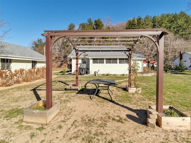 surrounding community with a pergola and a yard