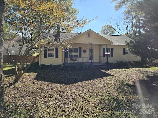 single story home featuring covered porch