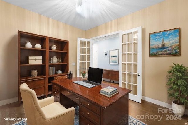 home office featuring dark hardwood / wood-style flooring and french doors