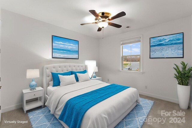 carpeted bedroom featuring ceiling fan