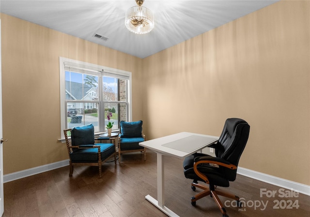 office space with dark hardwood / wood-style floors and a chandelier