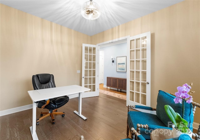 home office featuring french doors, a chandelier, and dark hardwood / wood-style floors