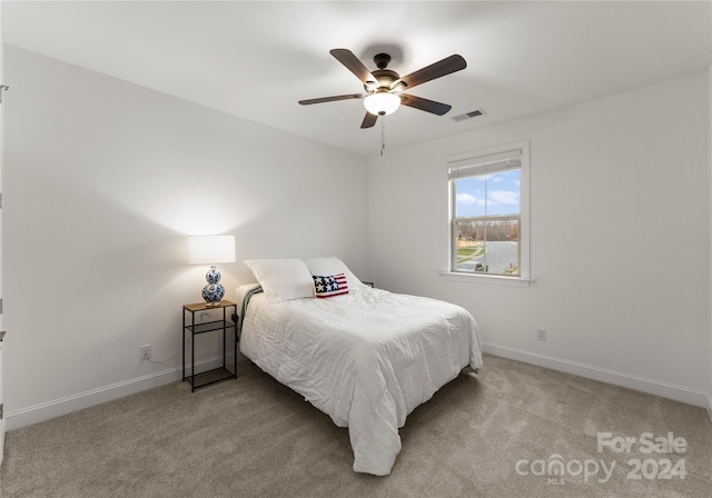 carpeted bedroom featuring ceiling fan