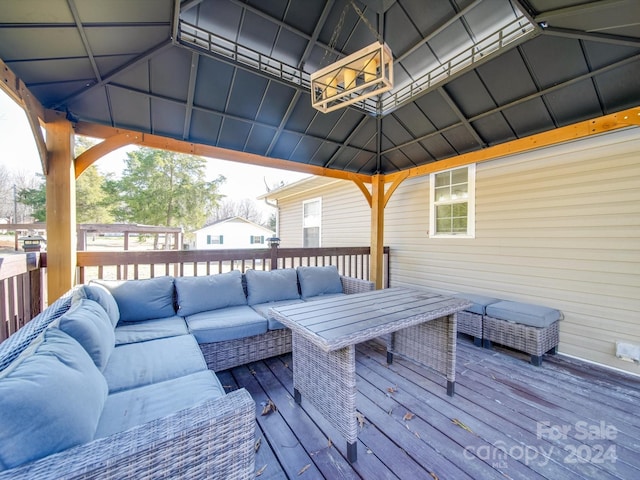 deck featuring a gazebo and outdoor lounge area