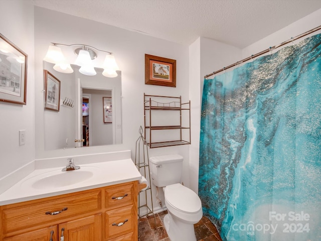 bathroom with a shower with shower curtain, vanity, toilet, and a textured ceiling