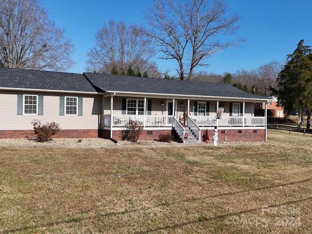 single story home with a front lawn and a porch