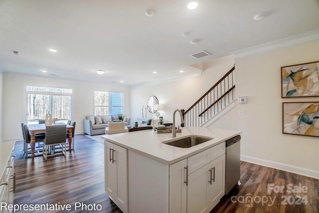 kitchen featuring sink, dark wood-type flooring, stainless steel dishwasher, a kitchen island with sink, and white cabinets