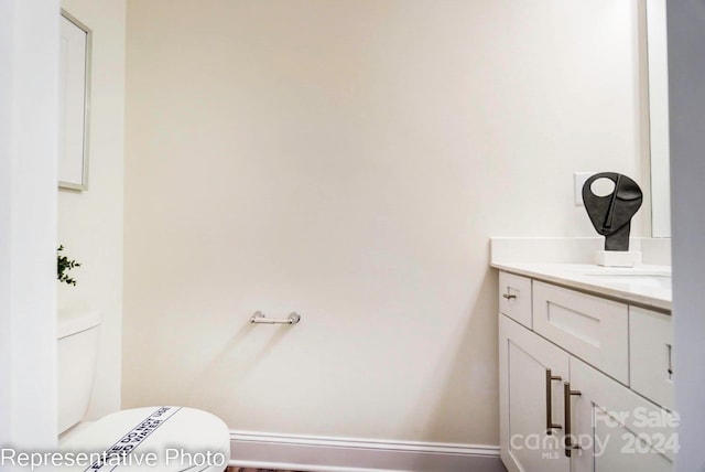 bathroom with vanity and toilet