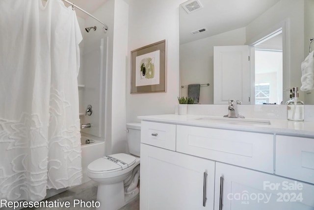 full bathroom featuring shower / tub combo, vanity, and toilet