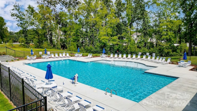 view of pool featuring a patio area