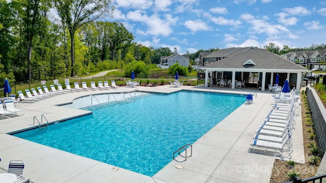 view of swimming pool with a patio