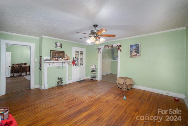 interior space featuring crown molding, ceiling fan, and wood-type flooring