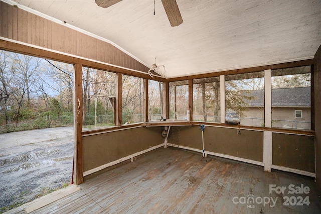 unfurnished sunroom featuring ceiling fan and lofted ceiling