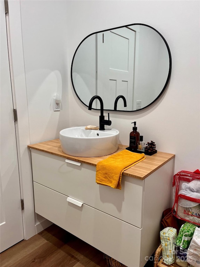 bathroom featuring wood-type flooring and vanity