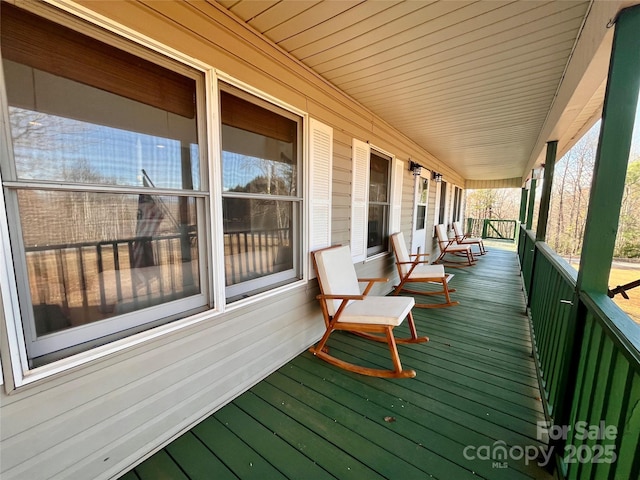 wooden terrace featuring a porch