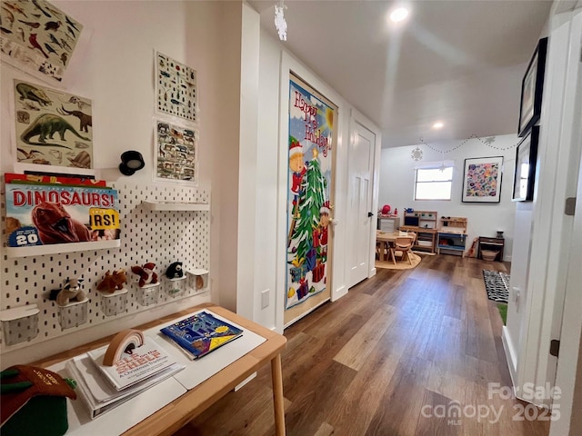 hallway with dark hardwood / wood-style floors