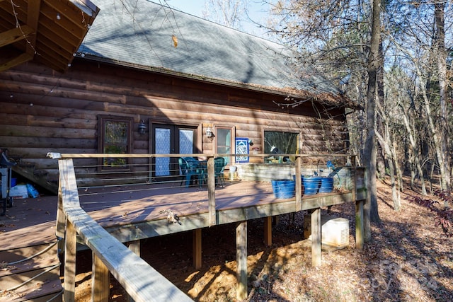 back of house featuring a deck and french doors