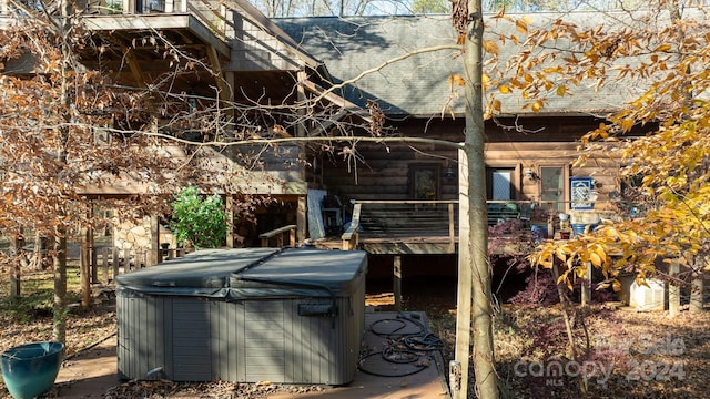 exterior space with a hot tub