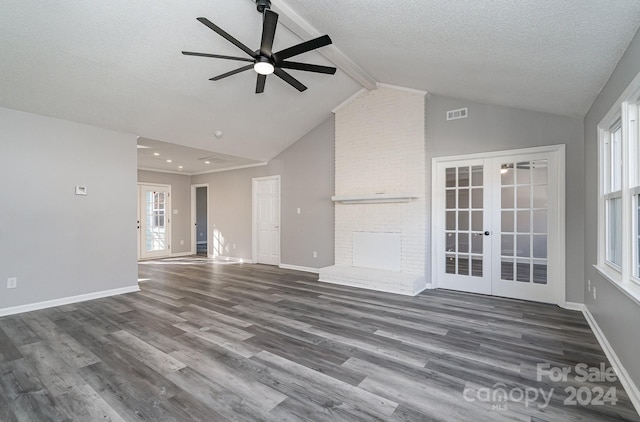 unfurnished living room featuring ceiling fan, dark hardwood / wood-style flooring, a wealth of natural light, and french doors