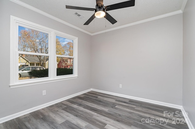 empty room with ceiling fan, crown molding, wood-type flooring, and a textured ceiling