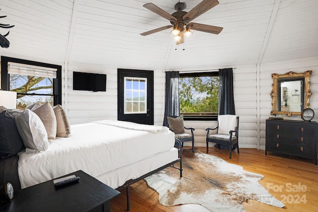 bedroom with multiple windows, ceiling fan, hardwood / wood-style floors, and wooden ceiling