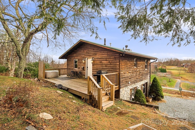 view of side of home featuring a wooden deck