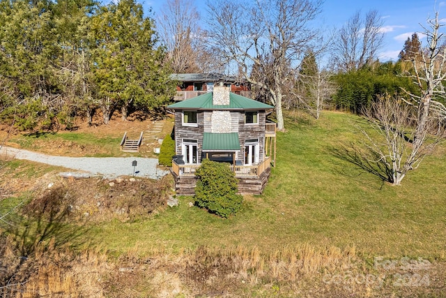 view of yard with covered porch