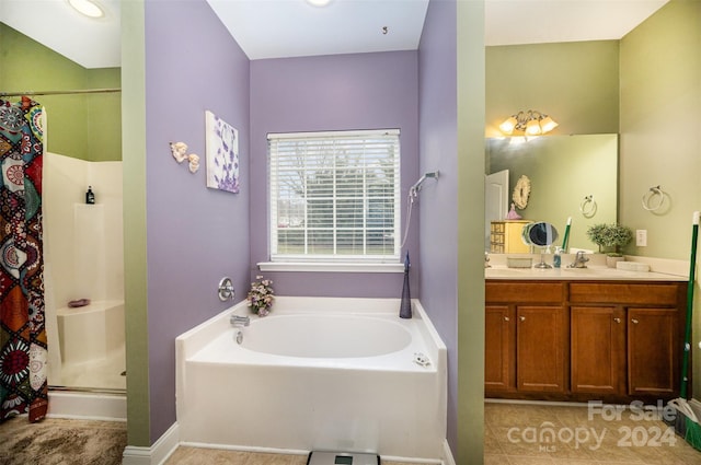 bathroom featuring tile patterned floors, vanity, and plus walk in shower