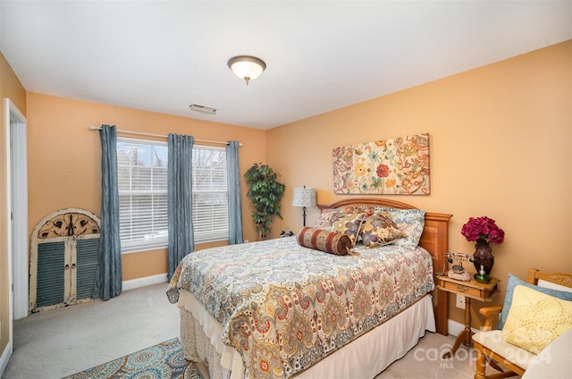 bedroom featuring light carpet