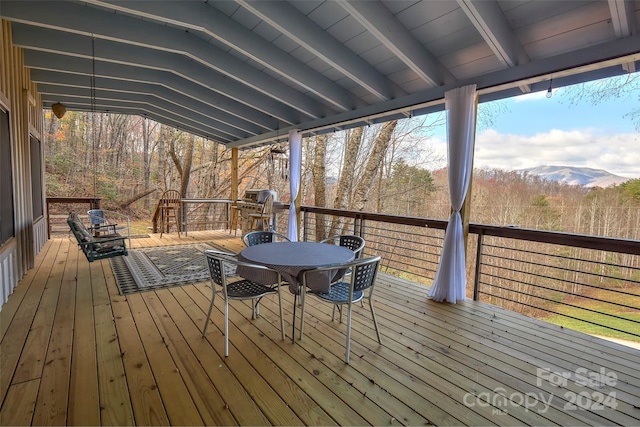 wooden deck featuring a mountain view