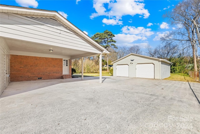 garage featuring a carport