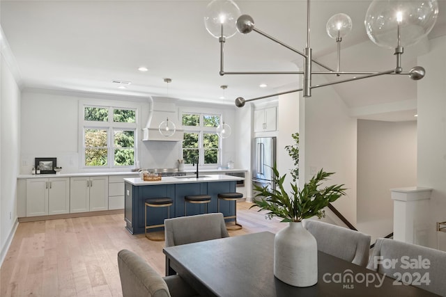 2023 Thurmond Pl Unit 14, Charlotte, NC 28205 - dining area featuring light wood finished floors, recessed lighting, and ornamental molding
