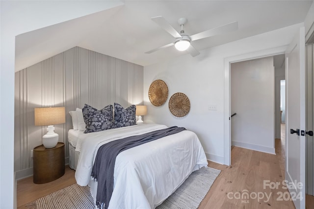 bedroom with ceiling fan and light wood-type flooring