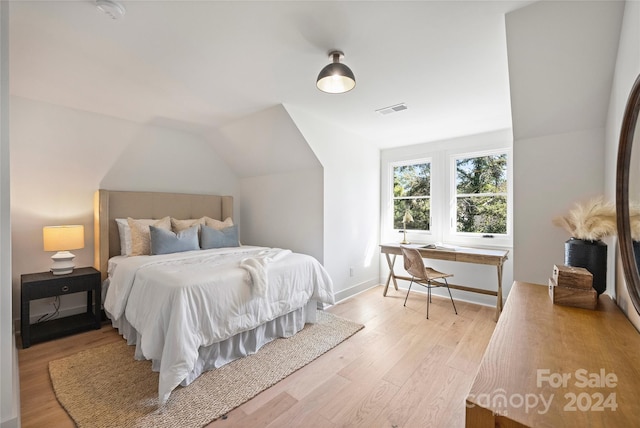 2023 Thurmond Pl Unit 14, Charlotte, NC 28205 - bedroom featuring light wood finished floors and lofted ceiling